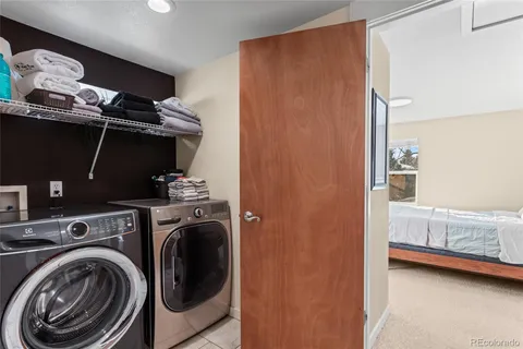 a bedroom with a bed and a windows