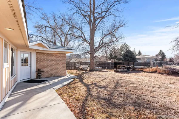a view of a house with a snow in the yard
