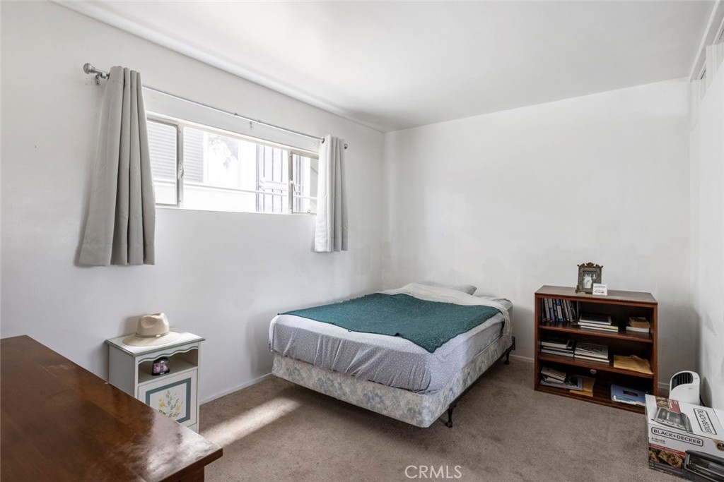 317 Sheldon Street El Segundo, CA 90245 - Photo 14 of 24 a bedroom with a bed and a window