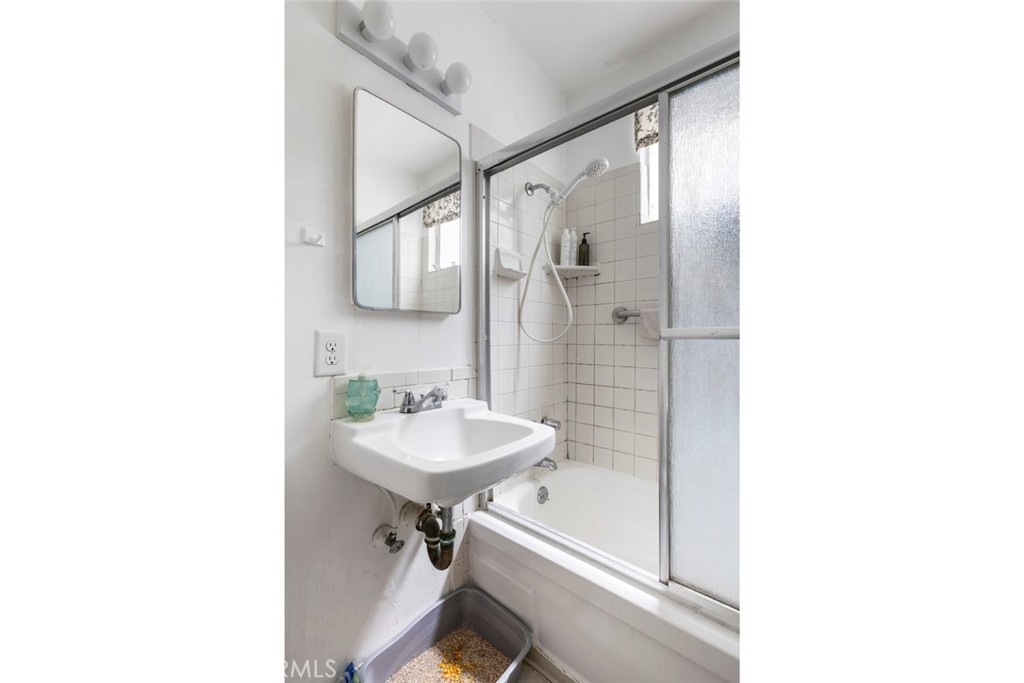 317 Sheldon Street El Segundo, CA 90245 - Photo 15 of 24 a bathroom with a sink a mirror and a shower