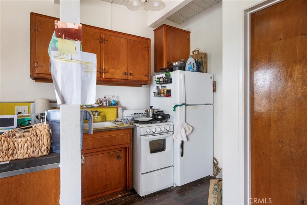 317 Sheldon Street El Segundo, CA 90245 - Photo 16 of 24 a white refrigerator freezer sitting inside of a kitchen