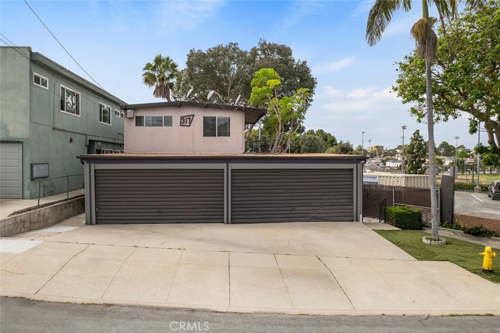 317 Sheldon Street El Segundo, CA 90245 - Photo 3 of 24 a view of a house with a garage