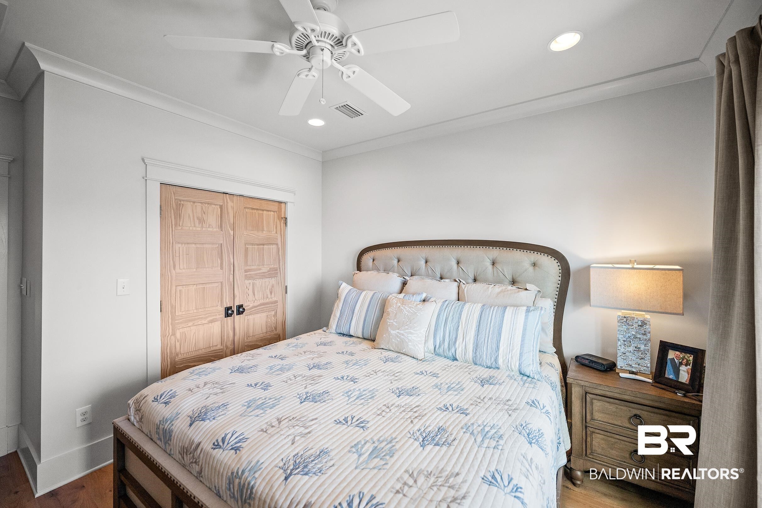 33186 Marlin Key Drive Orange Beach, AL 36561 - Photo 72 of 87 Bedroom with recessed lighting, crown molding, a ceiling fan, wood finished floors, and a closet