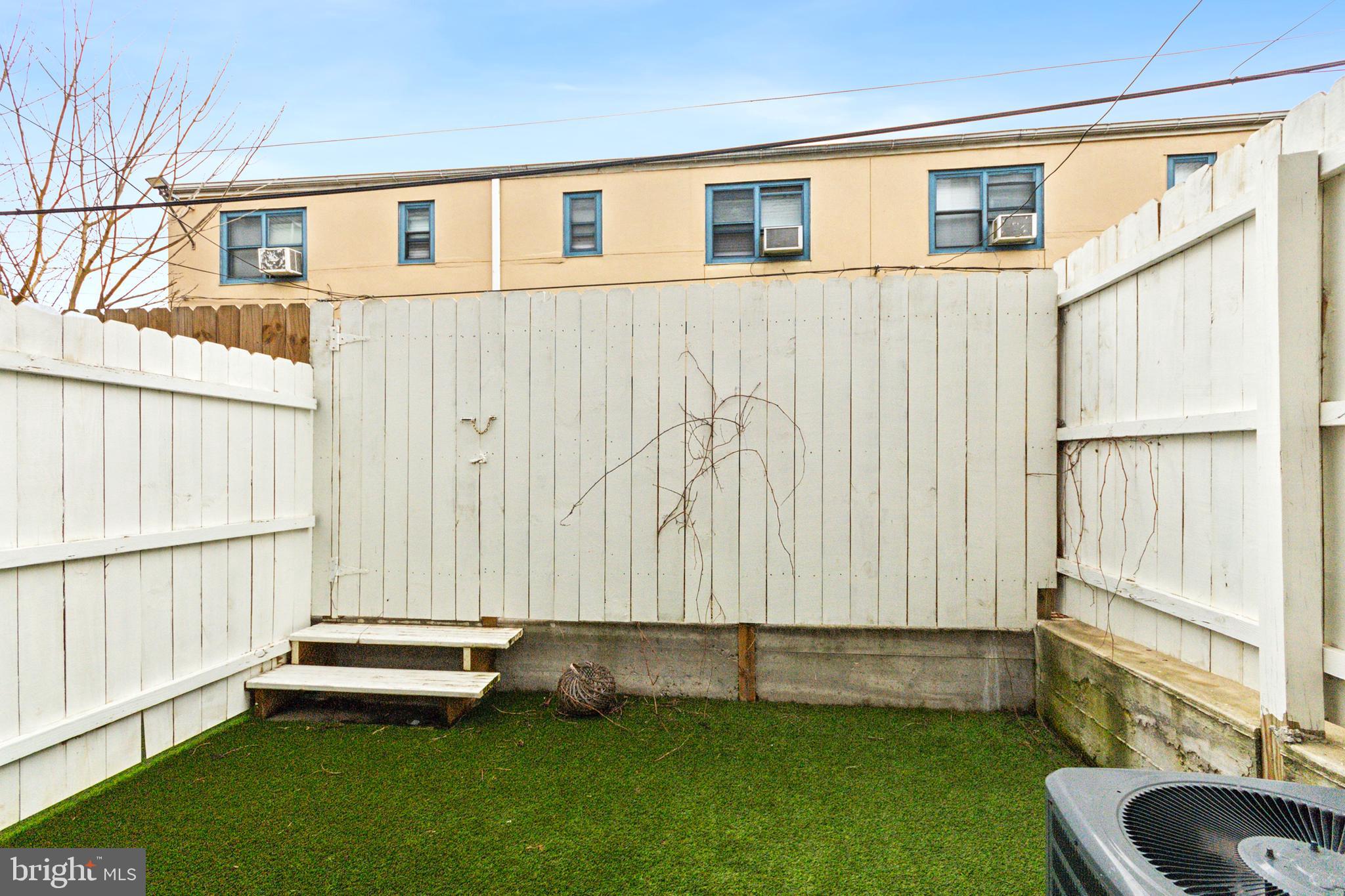 2145 Cross Street Philadelphia, PA 19146 - Photo 11 of 25 Fenced in turf backyard