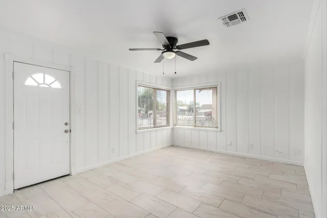 a view of an empty room with a window
