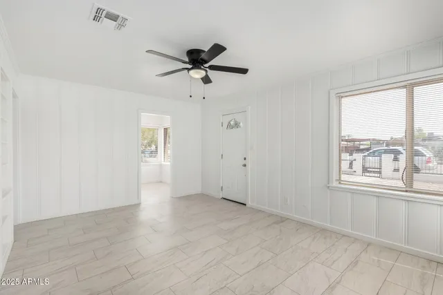 a view of an empty room with a window