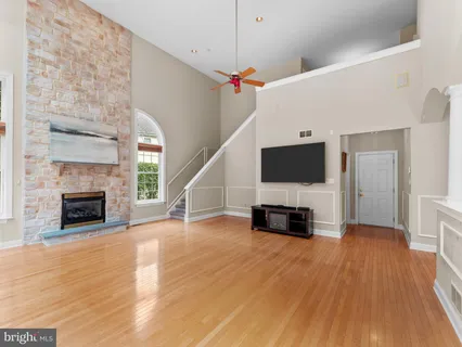 a view of a livingroom with an empty space and a fireplace