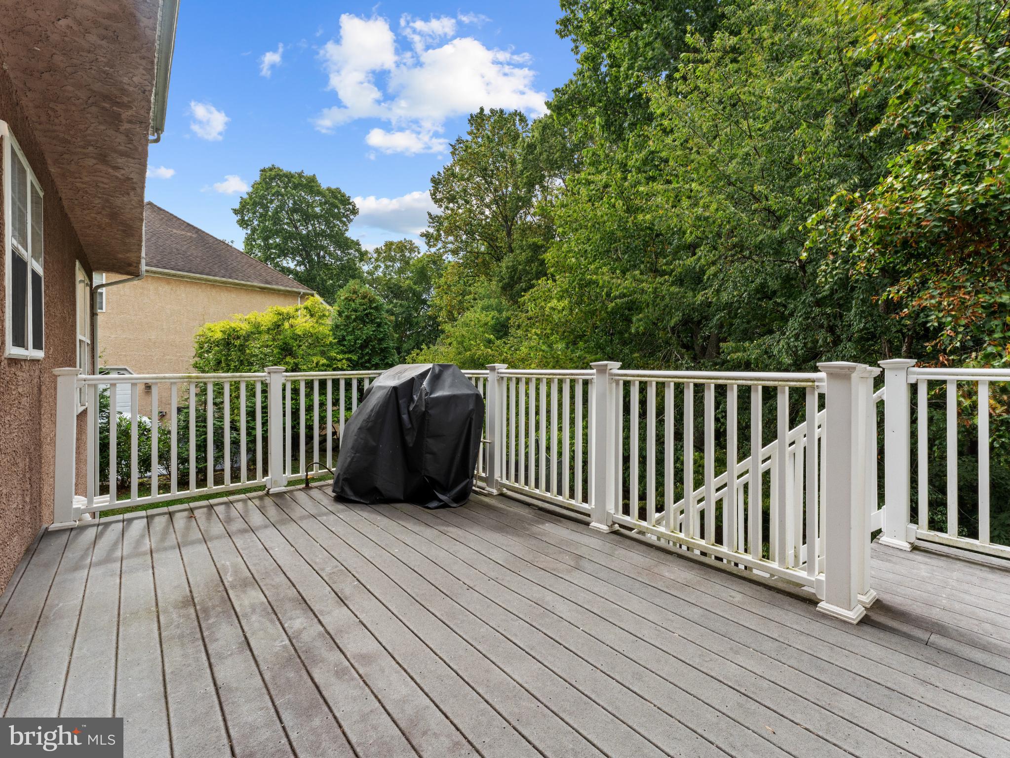 746 Kelli Lane Springfield, PA 19064 - Photo 36 of 41 Serene deck overlooking lush greenery.