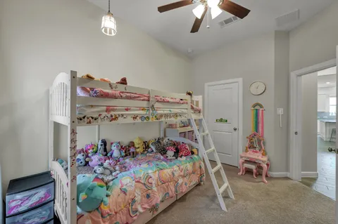 a bed room with a bed and a chandelier