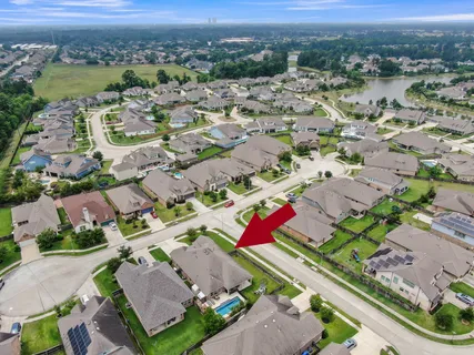 an aerial view of residential houses with outdoor space