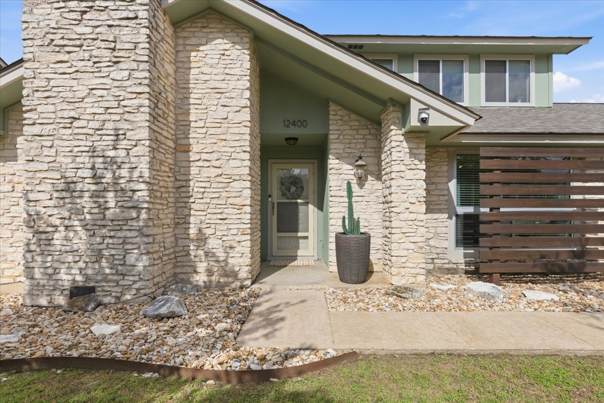 12400 Rusted Nail Cove Austin, TX 78750 - Photo 2 of 31 A welcoming front entry and timeless exterior design set the tone for the rest of the home.