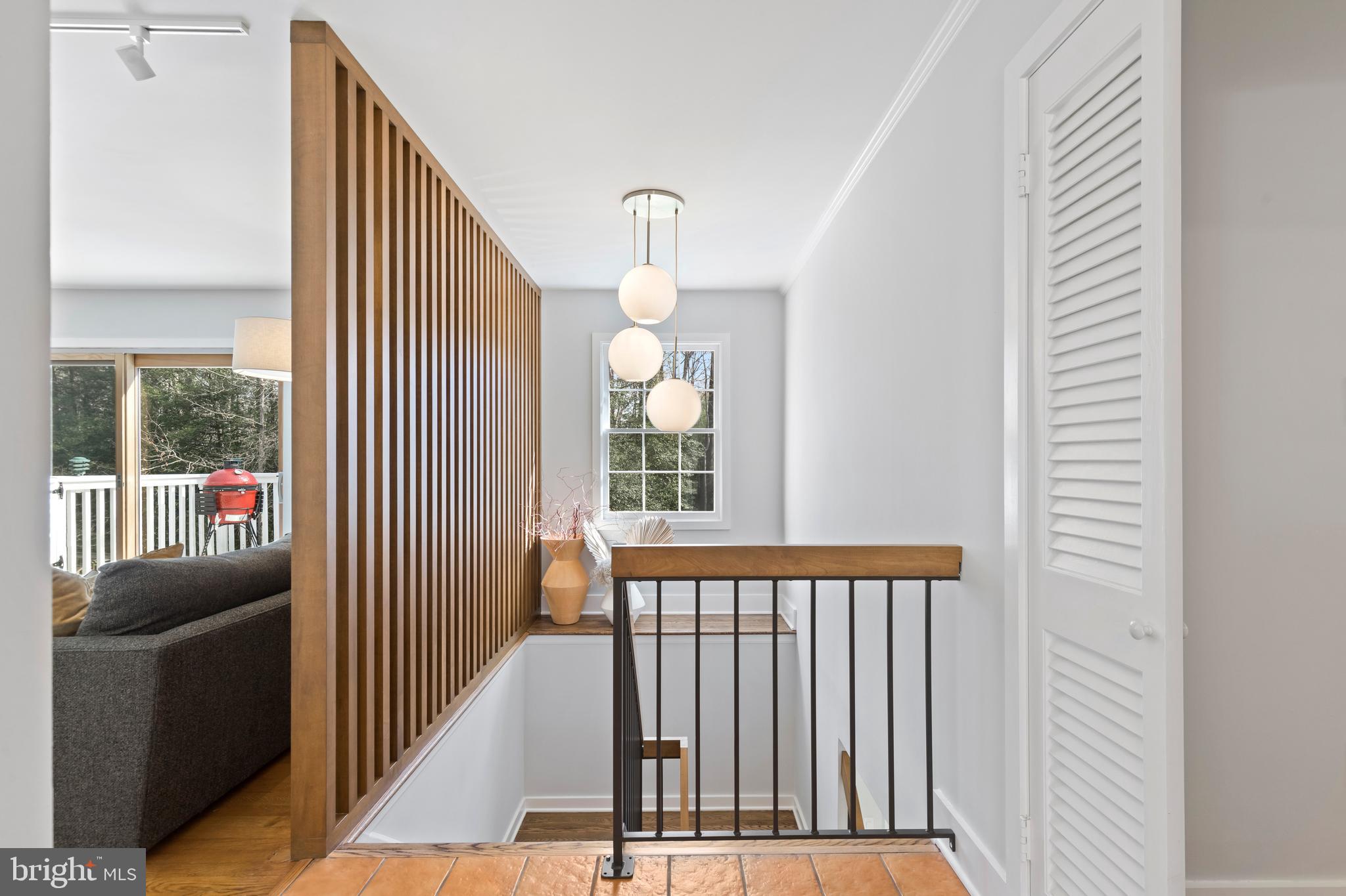 2509 Goldcup Lane Reston, VA 20191 - Photo 27 of 43 Wood and iron railing to downstairs