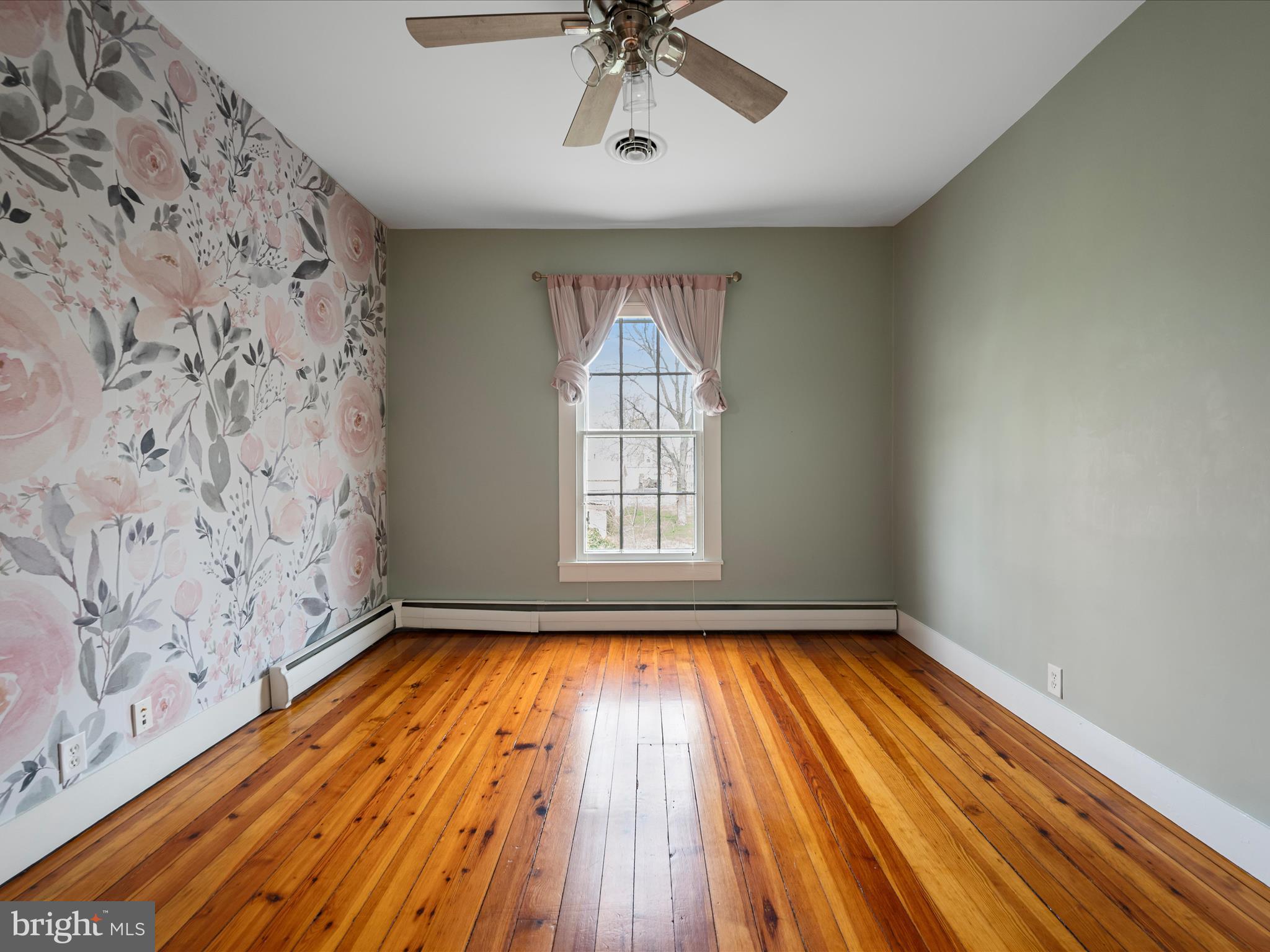 7919 Church Street Middletown, VA 22645 - Photo 26 of 48 a view of empty room with wooden floor and fan