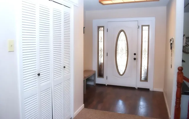 a kitchen with stainless steel appliances granite countertop sink stove and refrigerator