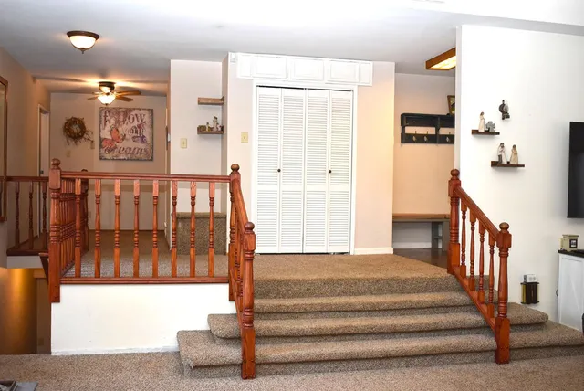 a large kitchen with kitchen island granite countertop a sink and cabinets
