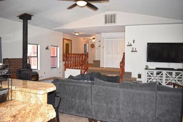 a stove top oven sitting inside of a kitchen