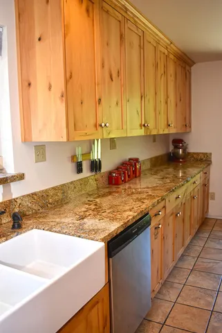 a bathroom with a toilet a sink and a window