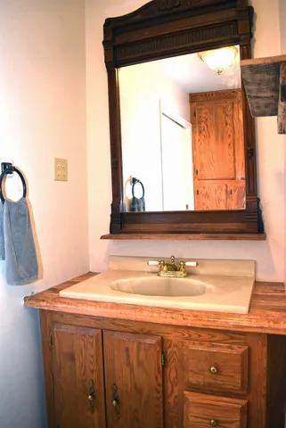 a bedroom with a bed and dresser