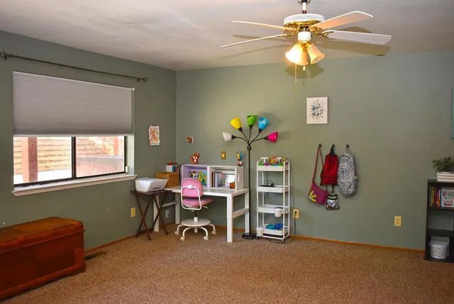 a view of a livingroom with furniture and a flat screen tv
