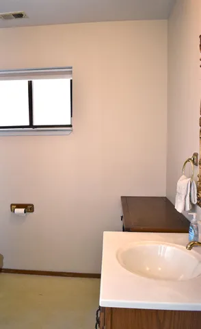 a front view of a house with trees