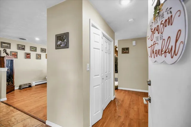 a view of a dining room with furniture and a window