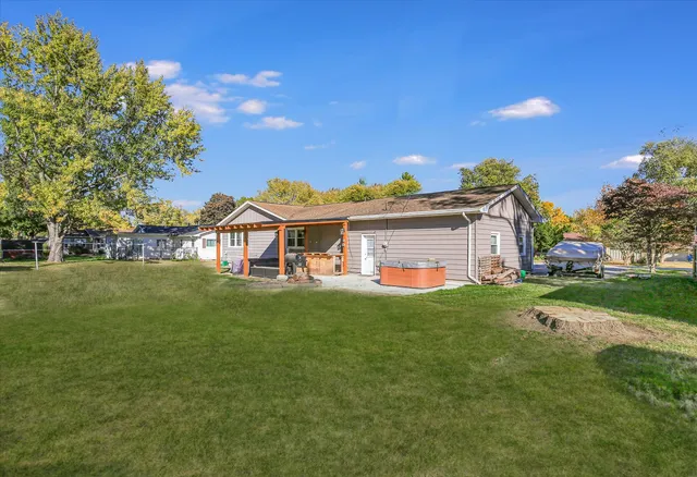 a living room with furniture ceiling fan and a rug