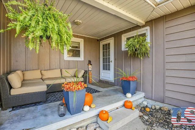 a view of a dining room with furniture and a large window