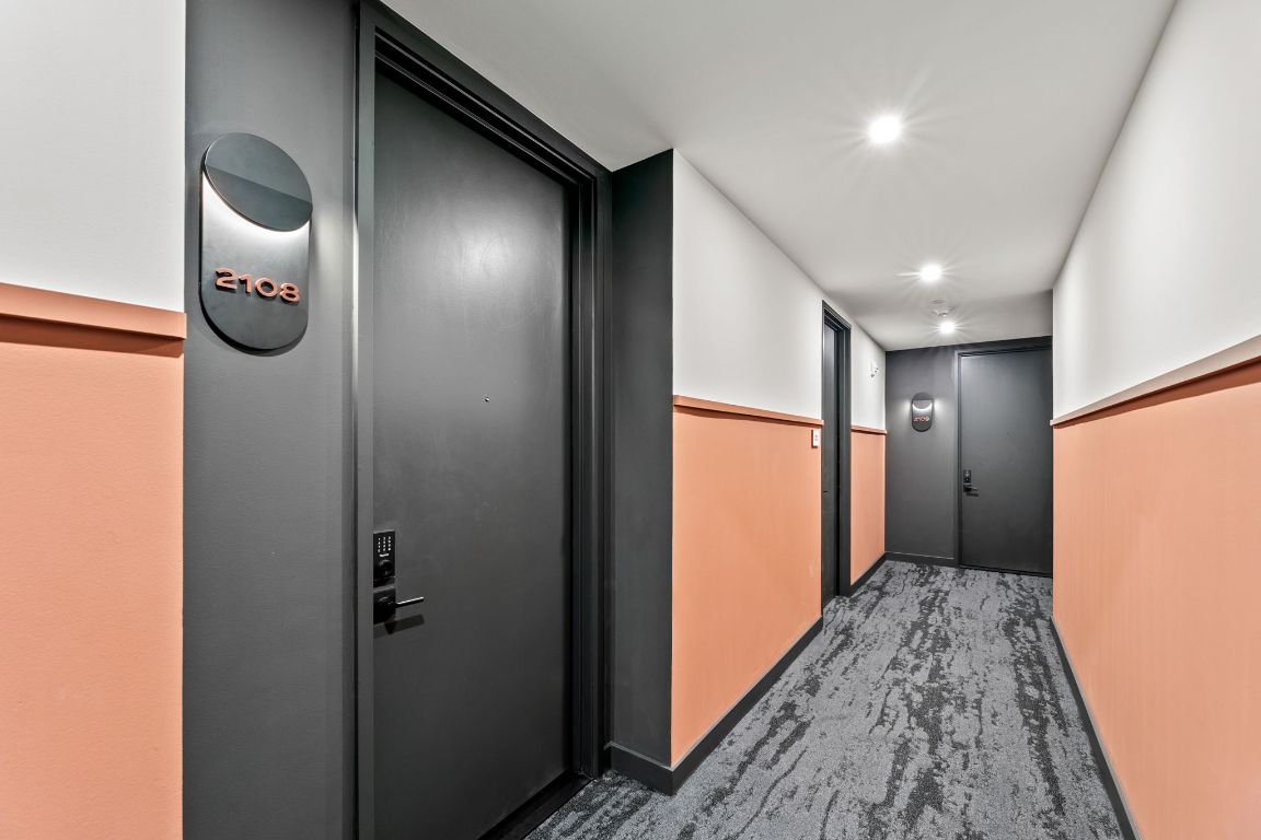 a view of hallway with wooden floor