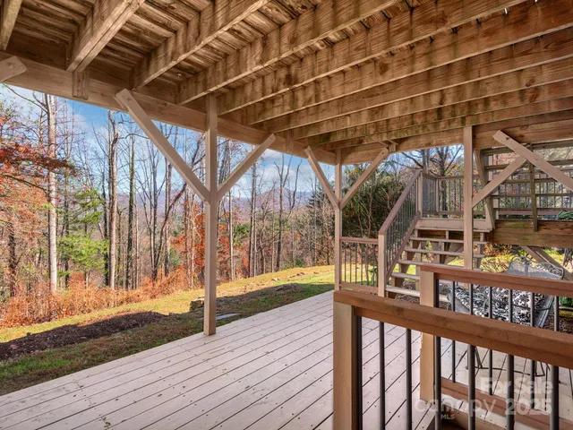 a view of a porch with wooden floor