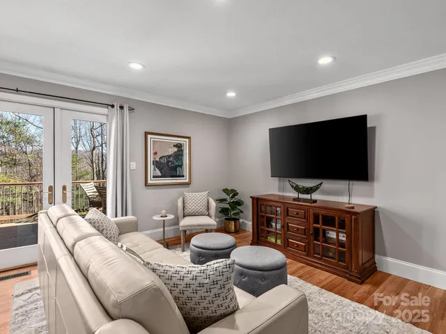 a living room with furniture and a flat screen tv
