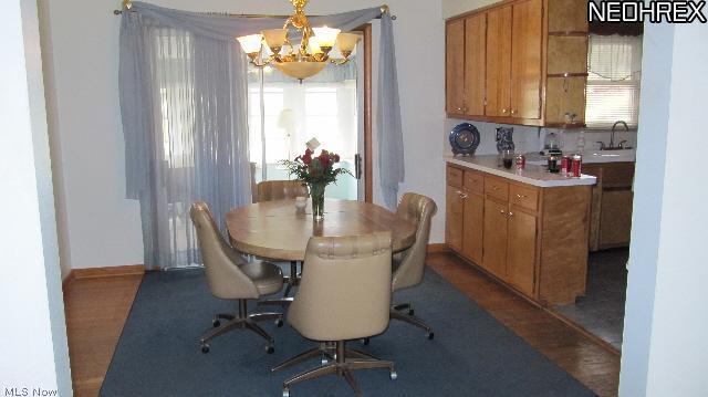 3537 Greenwich Road Norton, OH 44203 - Photo 5 of 21 Dinette has hardwood floor. Slider goes out to sunroom