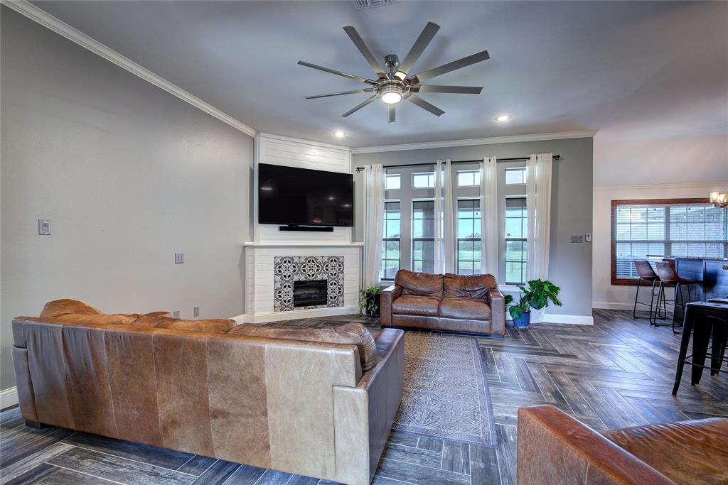 2027 Park Springs Road Sulphur Springs, TX 75482 - Photo 10 of 39 a living room with furniture and a flat screen tv