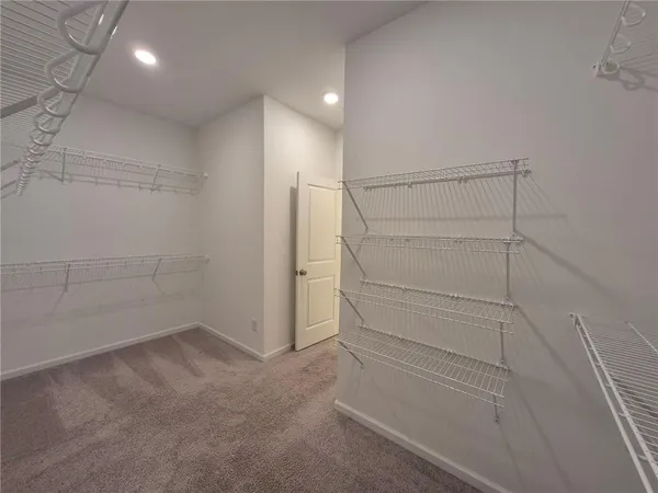 a view of an empty walk in closet