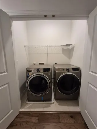 a utility room with dryer and washer