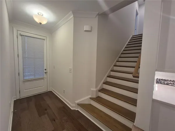 a view of entryway with wooden floor