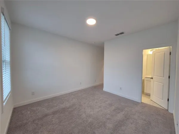 an empty room with closet area
