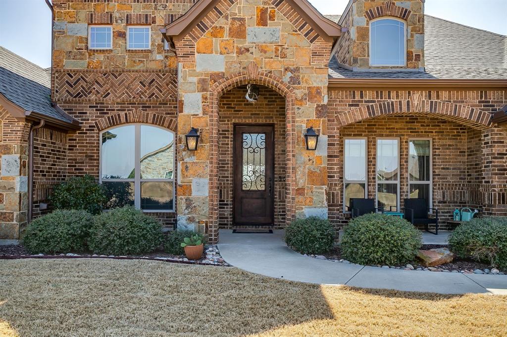 8613 Tuscan Way Godley, TX 76044 - Photo 4 of 40 Enticing entry with rich stone and brick