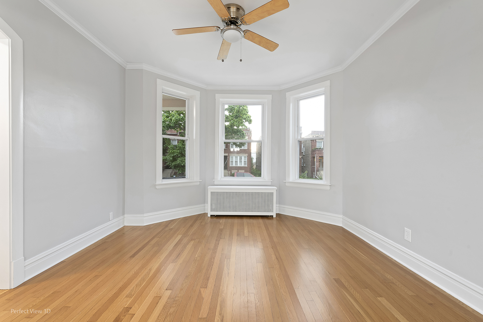 2108 Highland Avenue Berwyn, IL 60402 - Photo 2 of 32 wooden floor in an empty room with a window