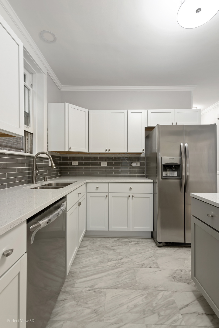 2108 Highland Avenue Berwyn, IL 60402 - Photo 12 of 32 a kitchen with a sink stove and refrigerator
