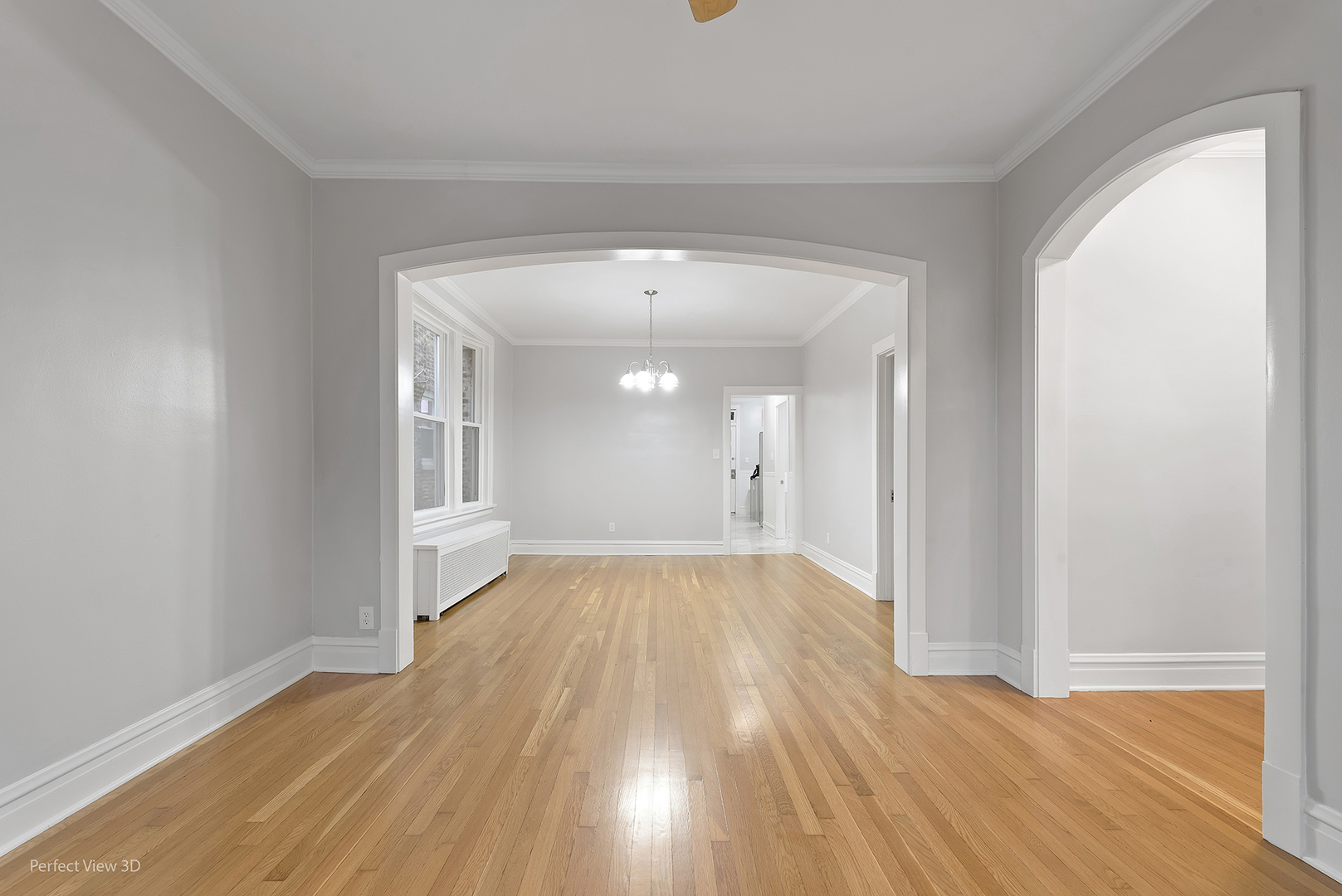 2108 Highland Avenue Berwyn, IL 60402 - Photo 3 of 32 a view of empty room with wooden floor and fan