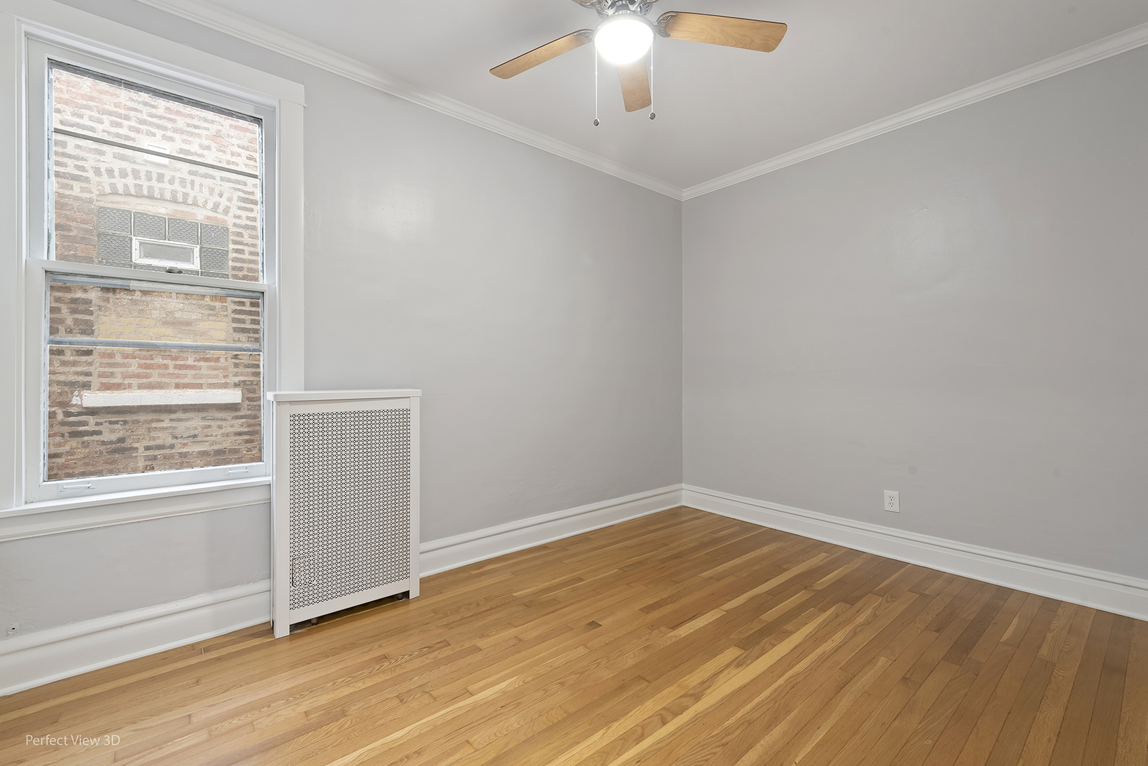 2108 Highland Avenue Berwyn, IL 60402 - Photo 21 of 32 a view of an empty room with wooden floor and a window