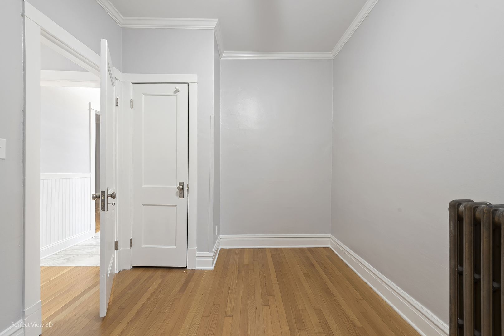2108 Highland Avenue Berwyn, IL 60402 - Photo 22 of 32 a view of an empty room with wooden floor and a window