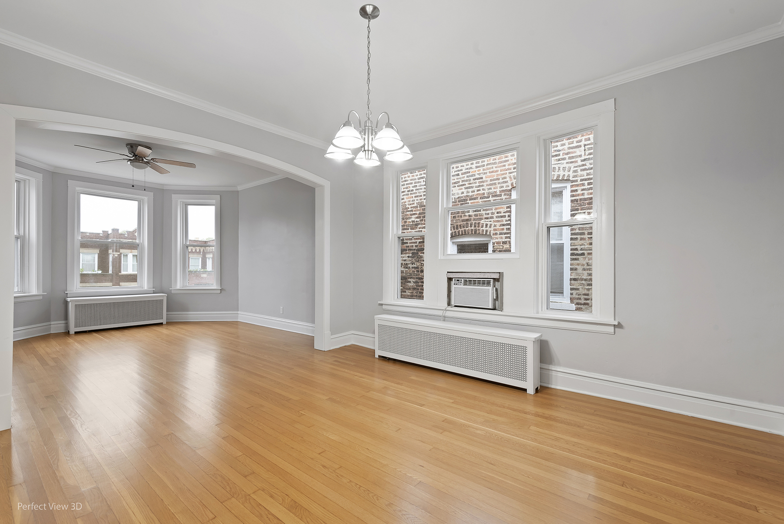 2108 Highland Avenue Berwyn, IL 60402 - Photo 23 of 32 a view of an empty room with wooden floor and a window