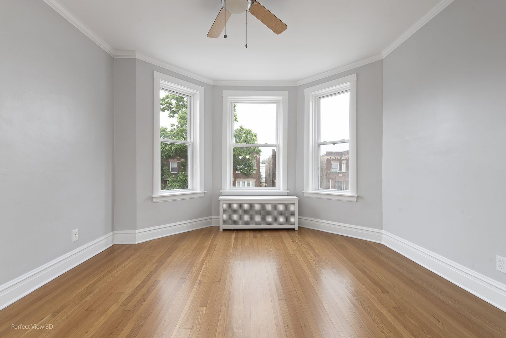 2108 Highland Avenue Berwyn, IL 60402 - Photo 25 of 32 an empty room with wooden floor and windows