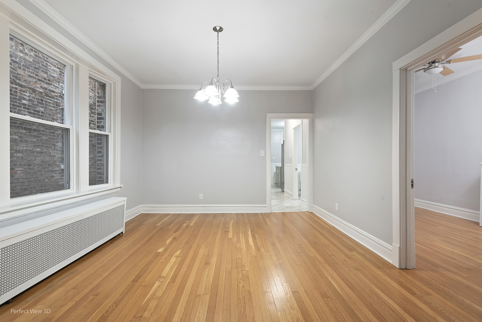 2108 Highland Avenue Berwyn, IL 60402 - Photo 4 of 32 a view of empty room with wooden floor and fan