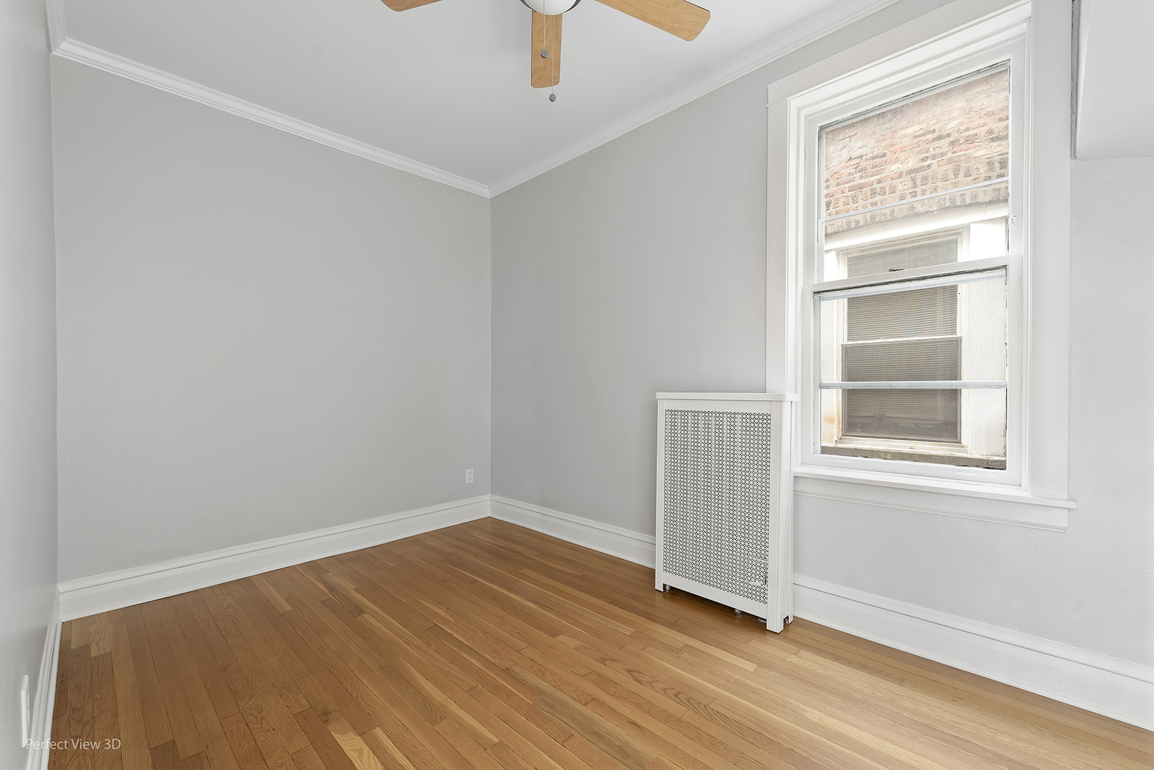 2108 Highland Avenue Berwyn, IL 60402 - Photo 6 of 32 an empty room with a window and wooden floor