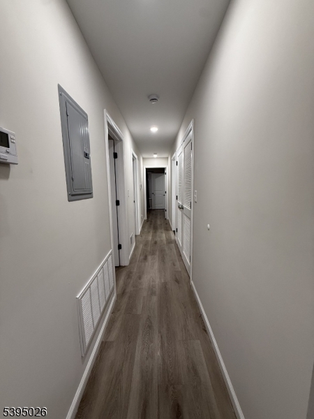 107 Willoughby Street, Unit 1 Newark, NJ 07112 - Photo 8 of 9 a view of a hallway with wooden floor