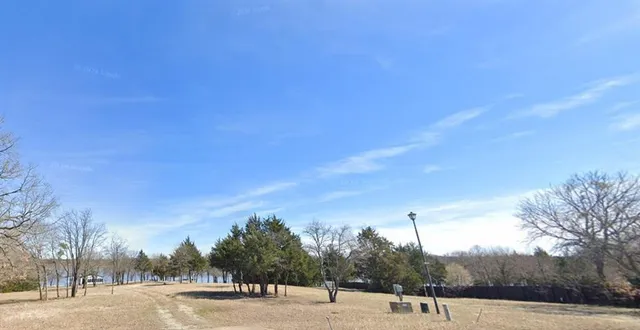 a view of a outdoor space with trees in the background
