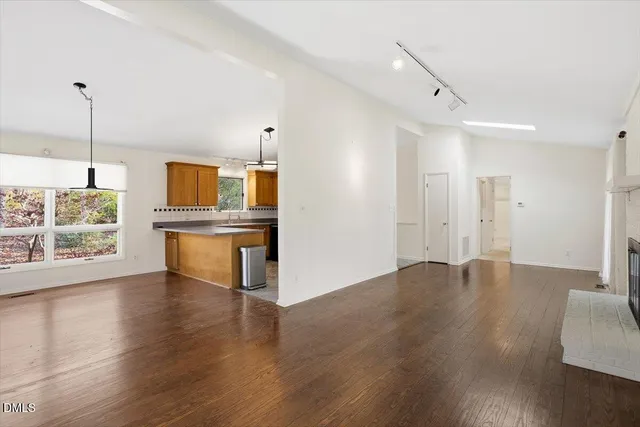 a kitchen with a sink cabinets and window