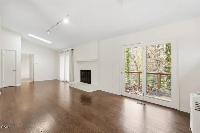 a kitchen with stainless steel appliances a stove a sink and a microwave